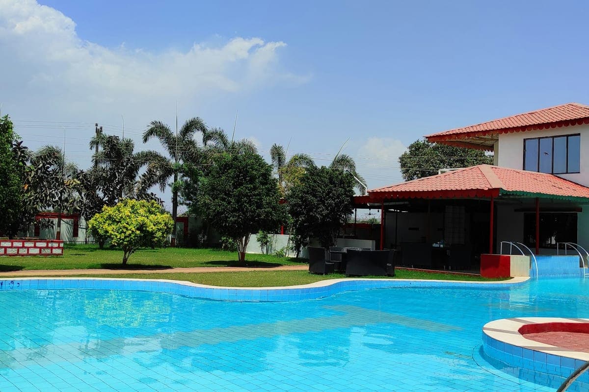 Representative image for Civil Lines Phase-1: a swimming pool beside landscaped lawns