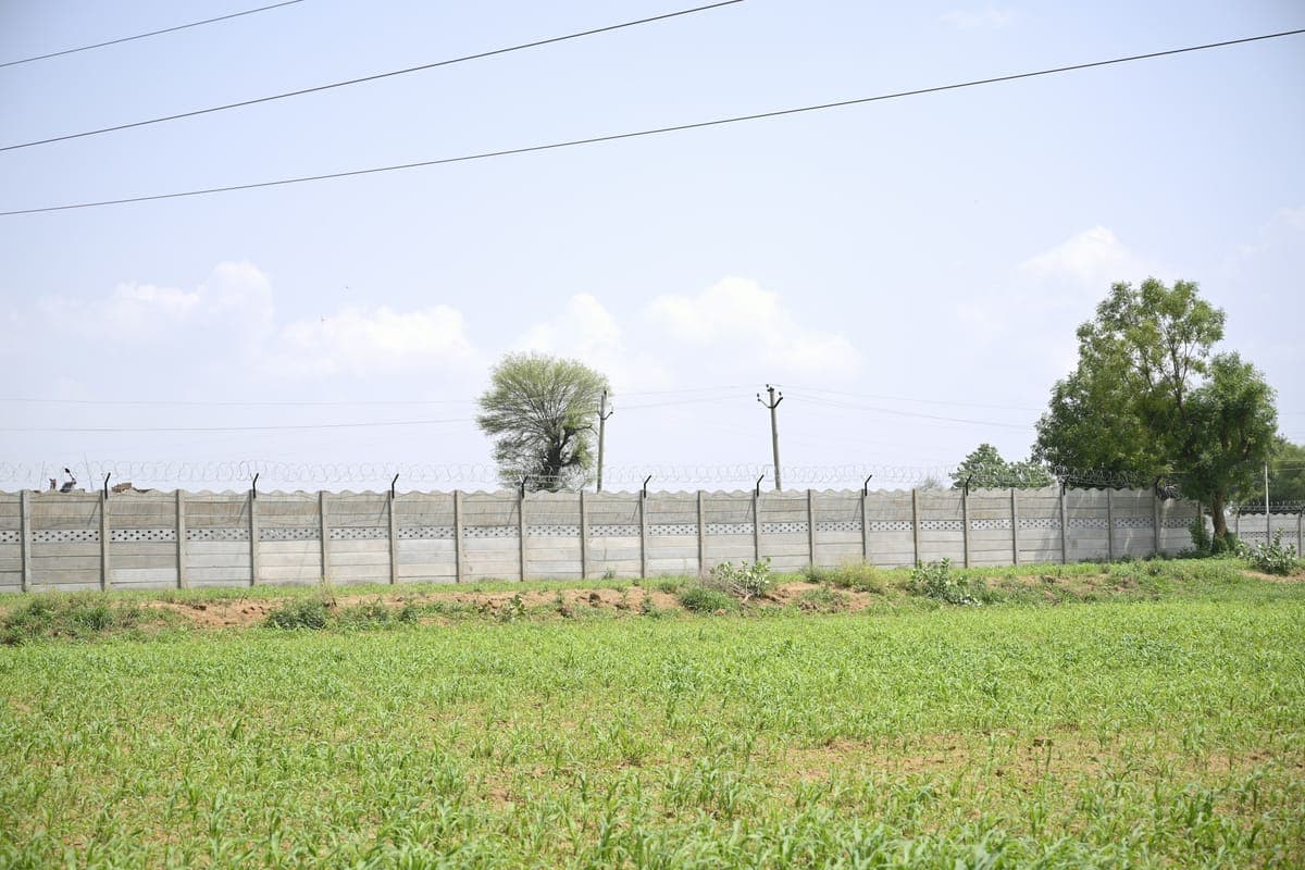 Representative image for Durga Residency: open land enclosed by a boundary wall
